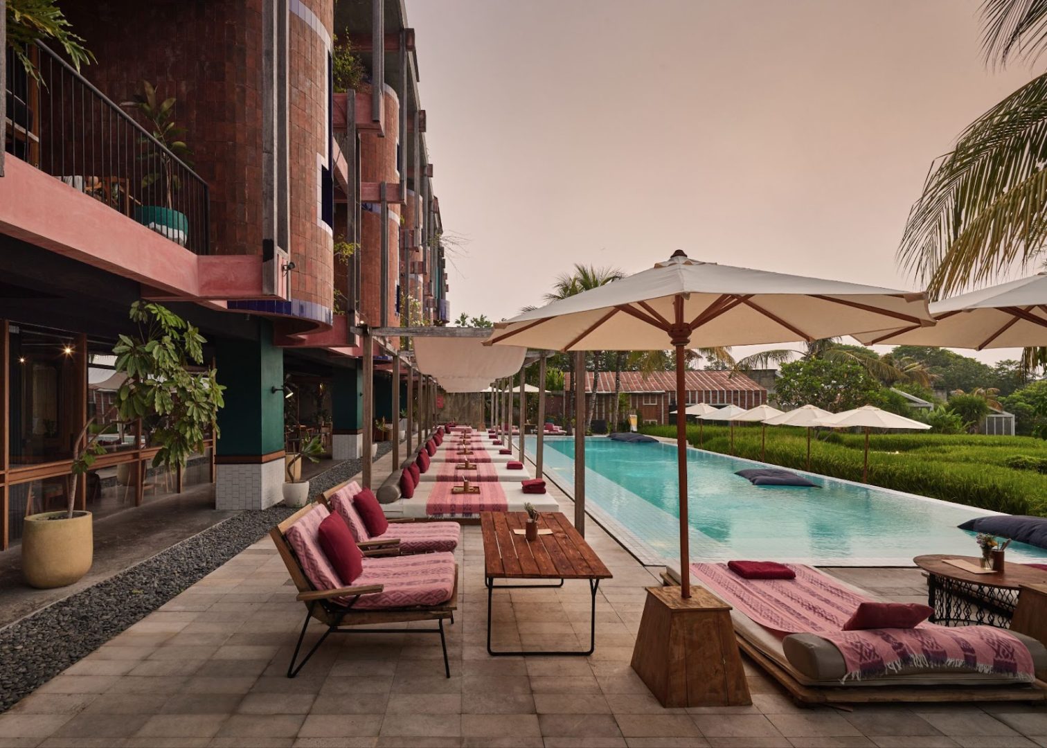 Best Hotel in Canggu: A Brutalist Resort for Nomad Travelers. Boheme Restaurant Pool & Daybed.